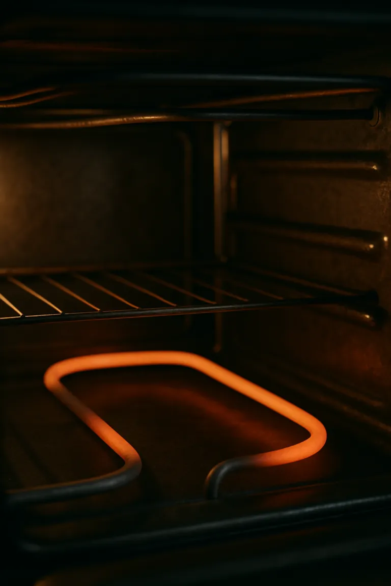Oven heating element inspected for a repair